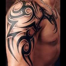 Tribal Shoulder And Chest Tattoo